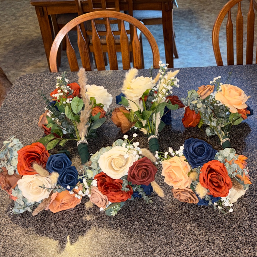 Rustic Floral Arrangement with Orange, Cream, and Blue Accents